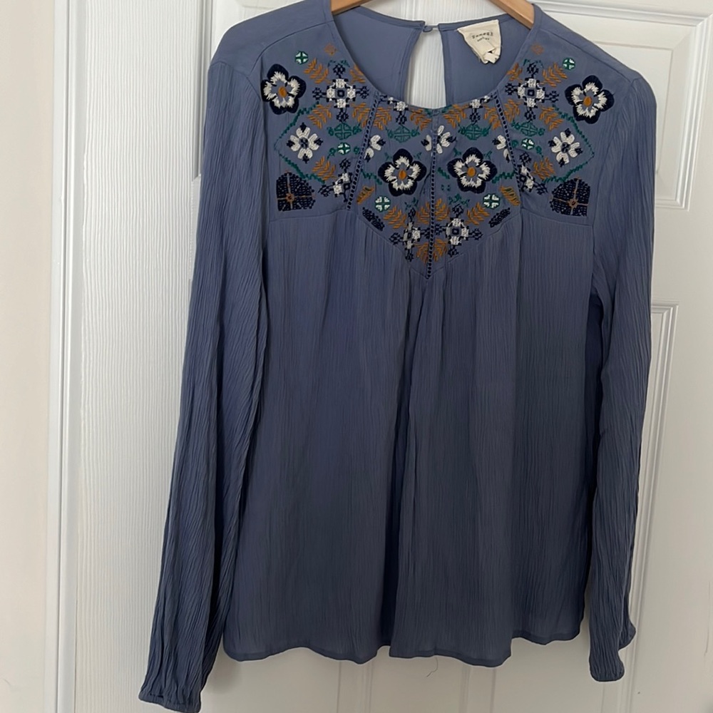 Light blue long sleeve with floral Pattern